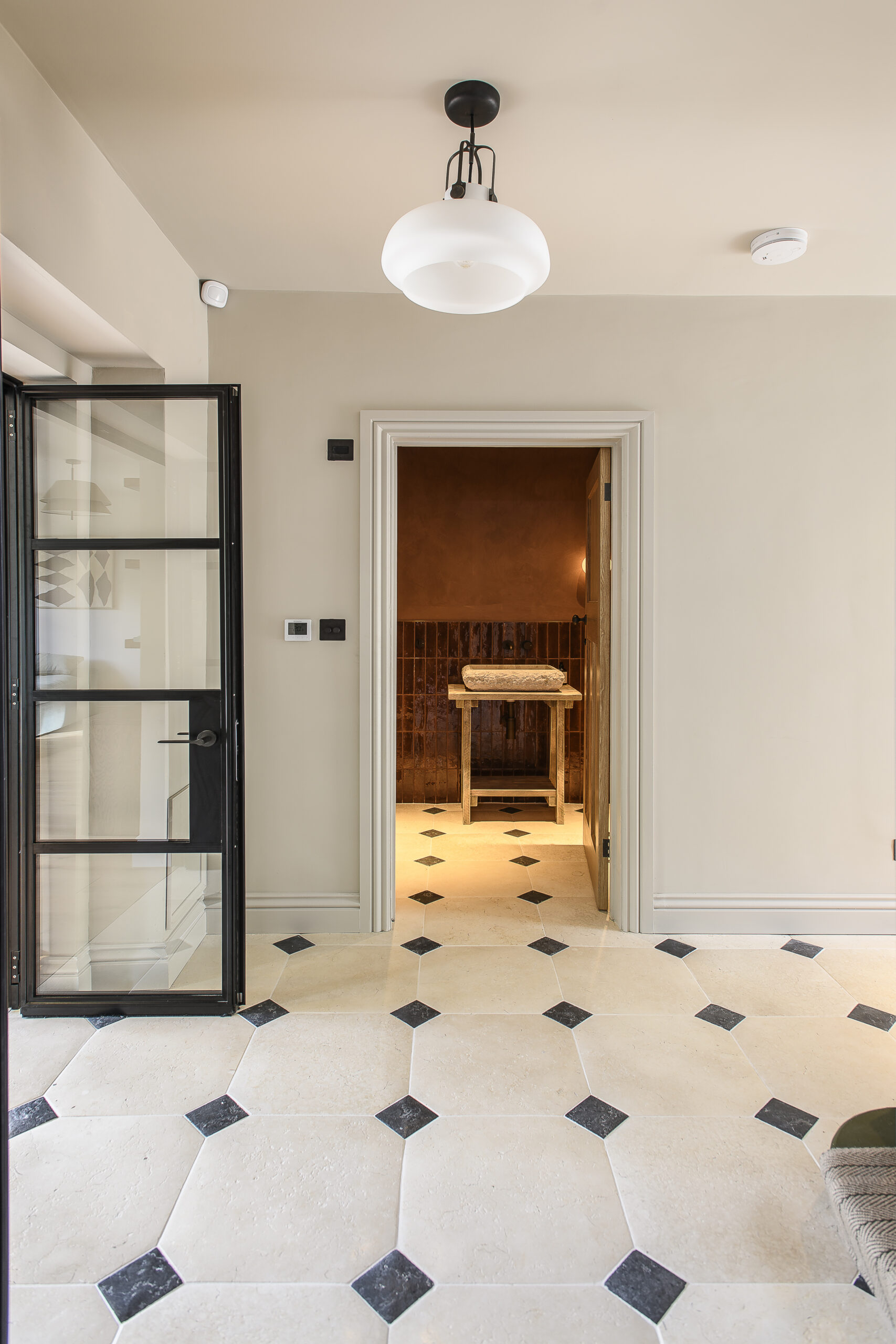 Hallway and downtairs bathroom at Rossmead in Hassocks