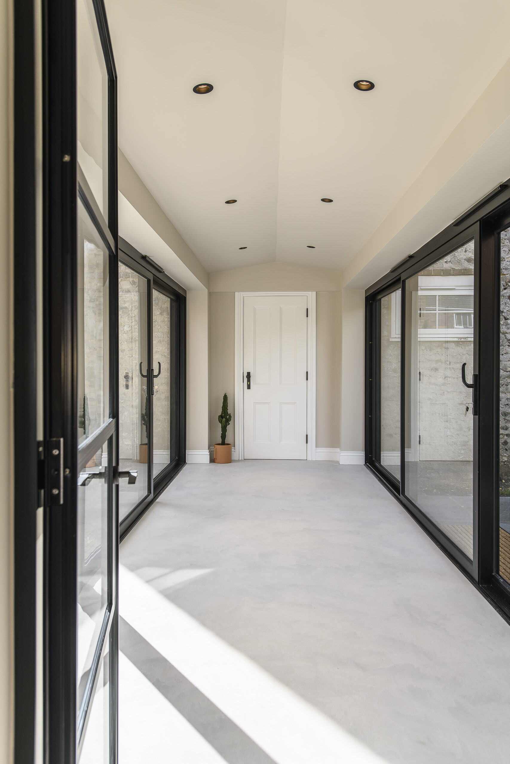 Internal view of glazed link building at Rossmead in Hassocks - looking towards annexe